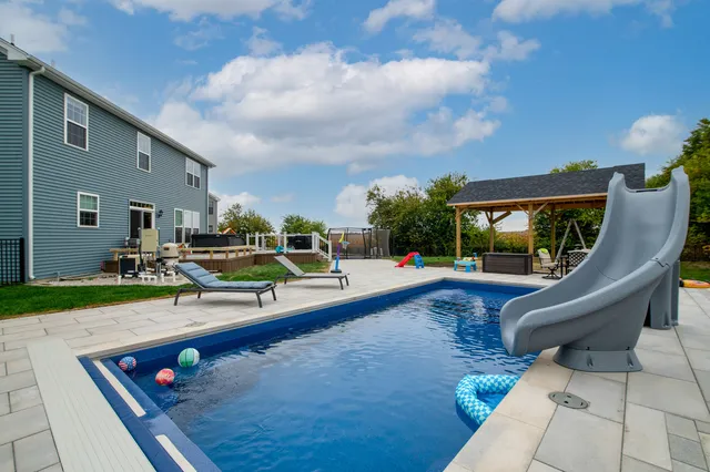a view of a patio with swimming pool