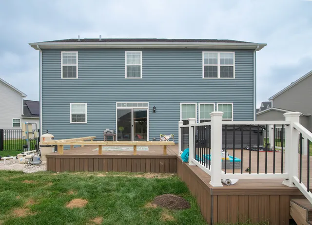 a front view of house with yard outdoor seating and porch