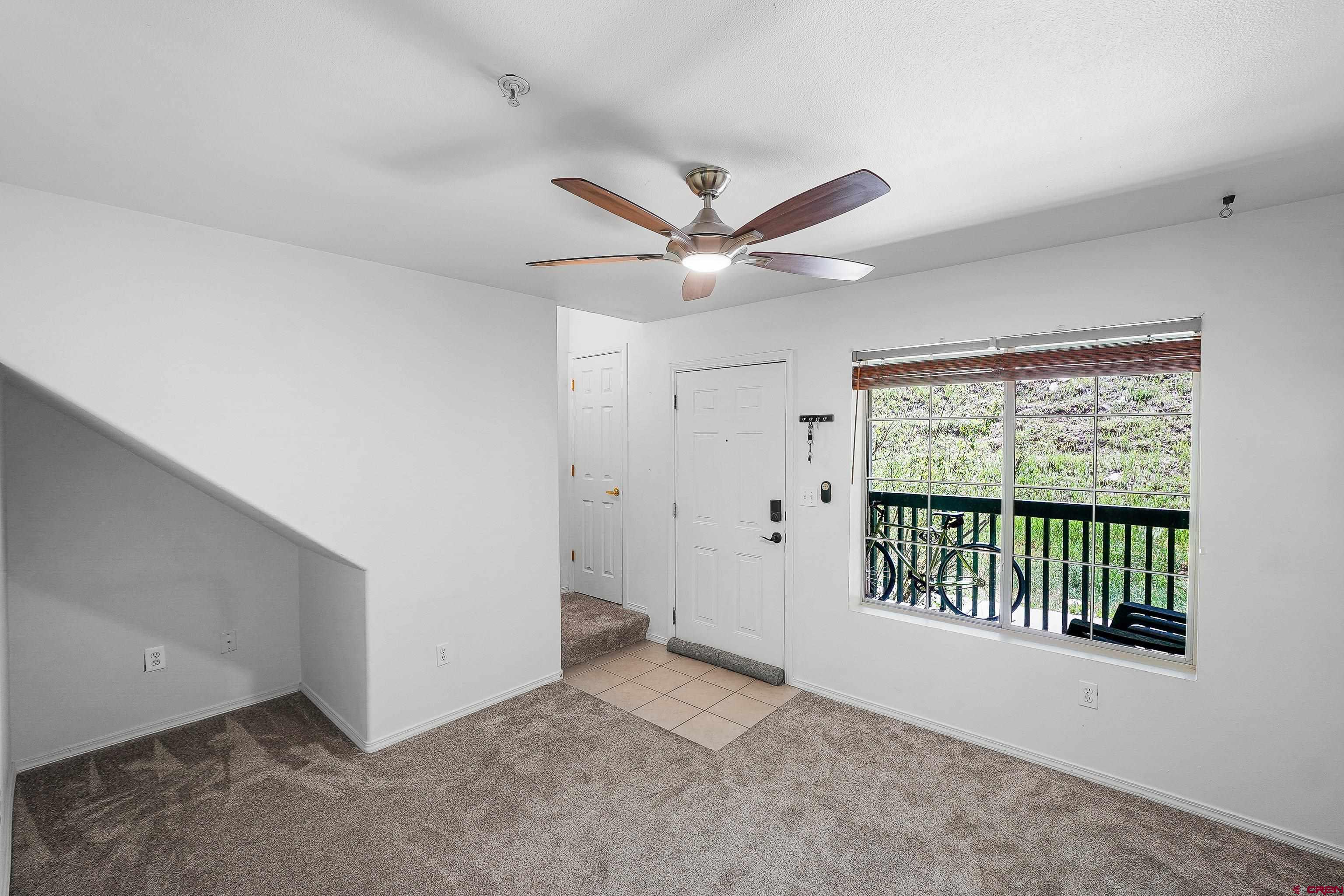 1100 Goeglein Gulch Road, Unit 163 Durango, CO 81301 - Photo 7 of 23 a view of an empty room with a window