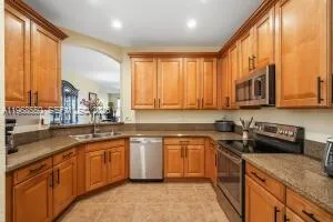 a kitchen with a sink and a refrigerator
