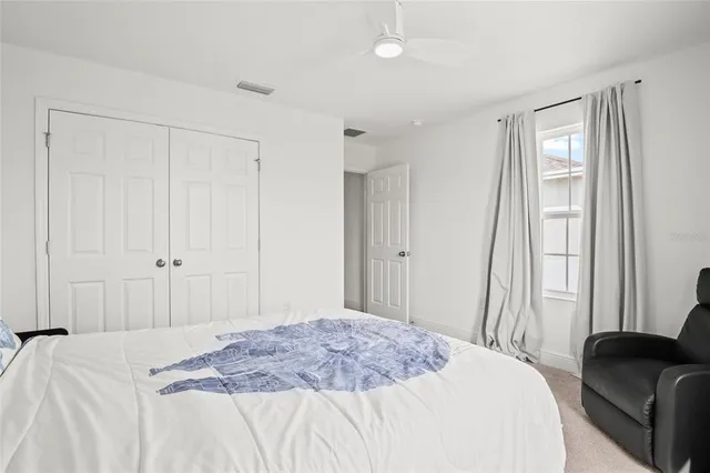 a aerial view of a house with a yard