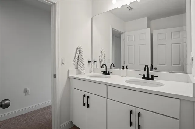 an aerial view of a house with swimming pool and outdoor space