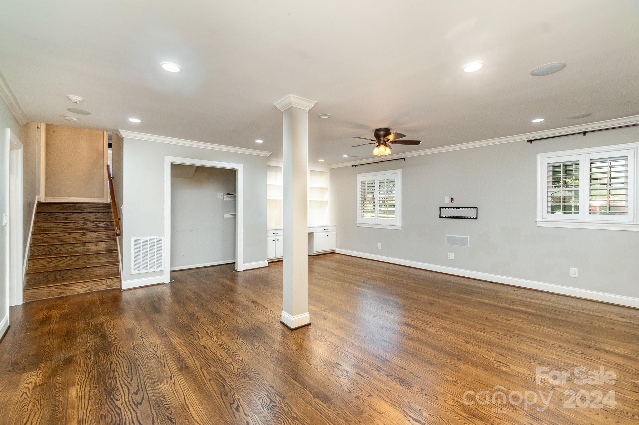 1008 Dumbarton Road Gastonia, NC 28054 - Photo 12 of 39 a view of an empty room with wooden floor and a window