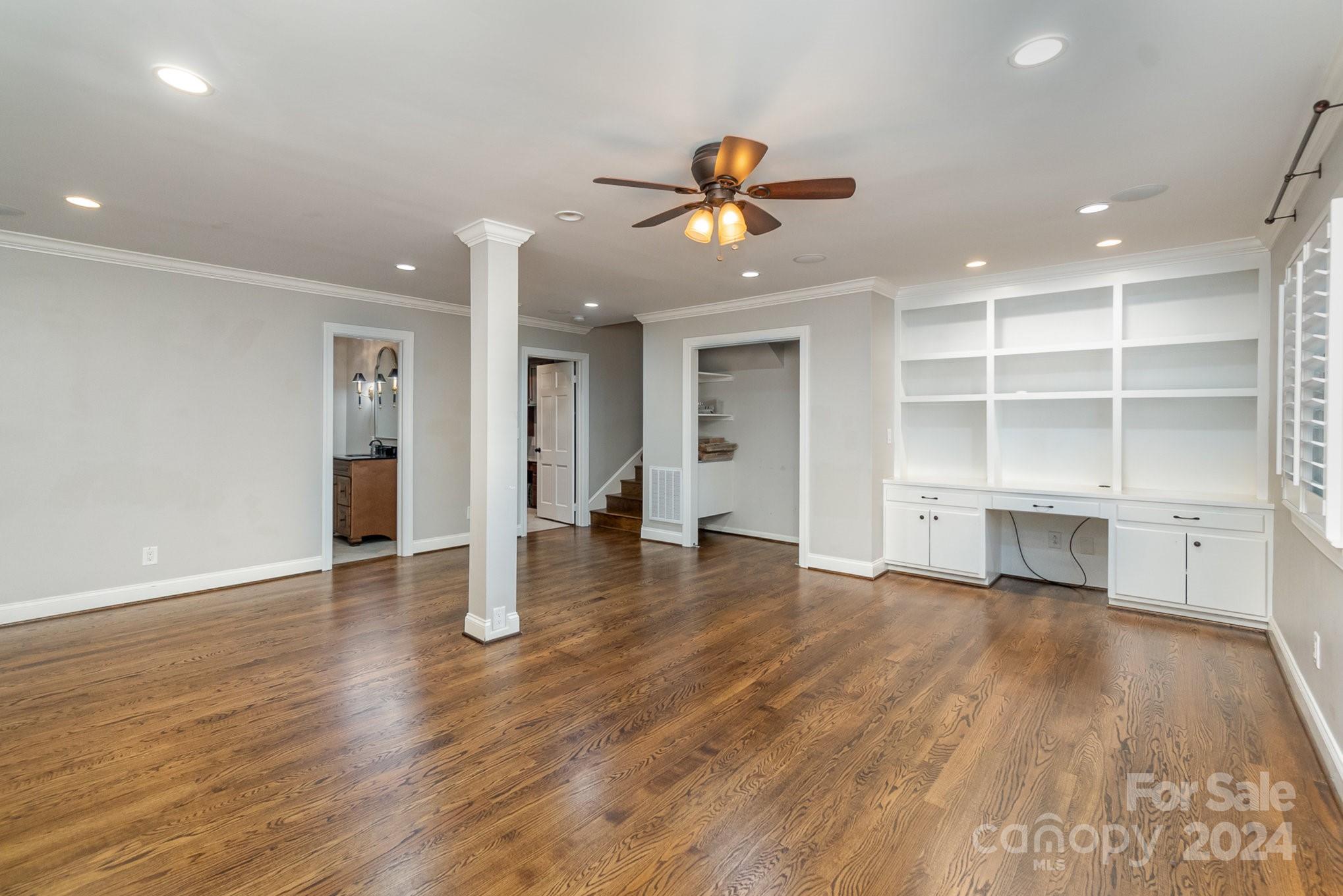 1008 Dumbarton Road Gastonia, NC 28054 - Photo 13 of 39 a view of a room with wooden floor and ceiling fan
