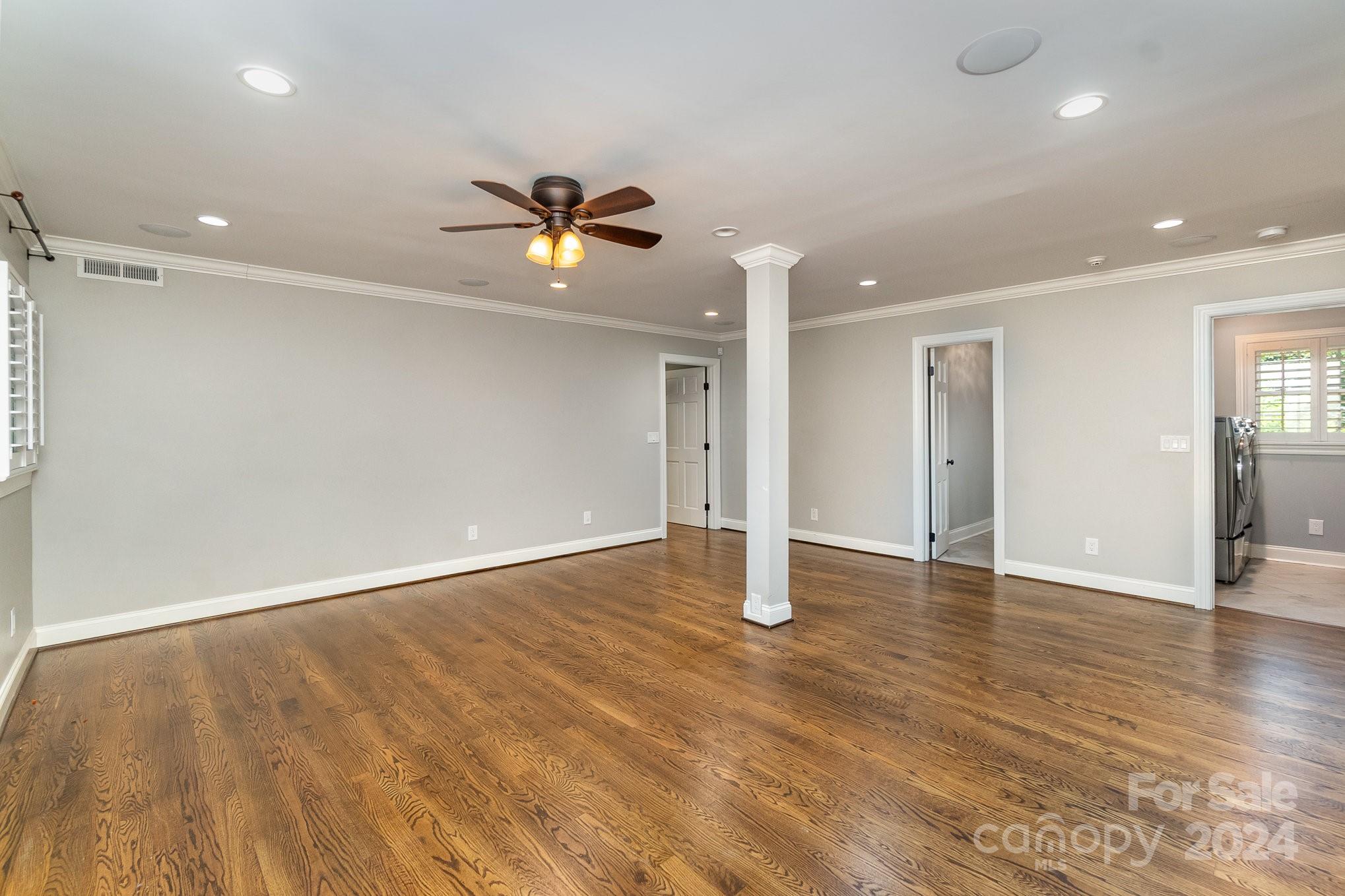 1008 Dumbarton Road Gastonia, NC 28054 - Photo 14 of 39 a view of empty room with wooden floor and ceiling fan