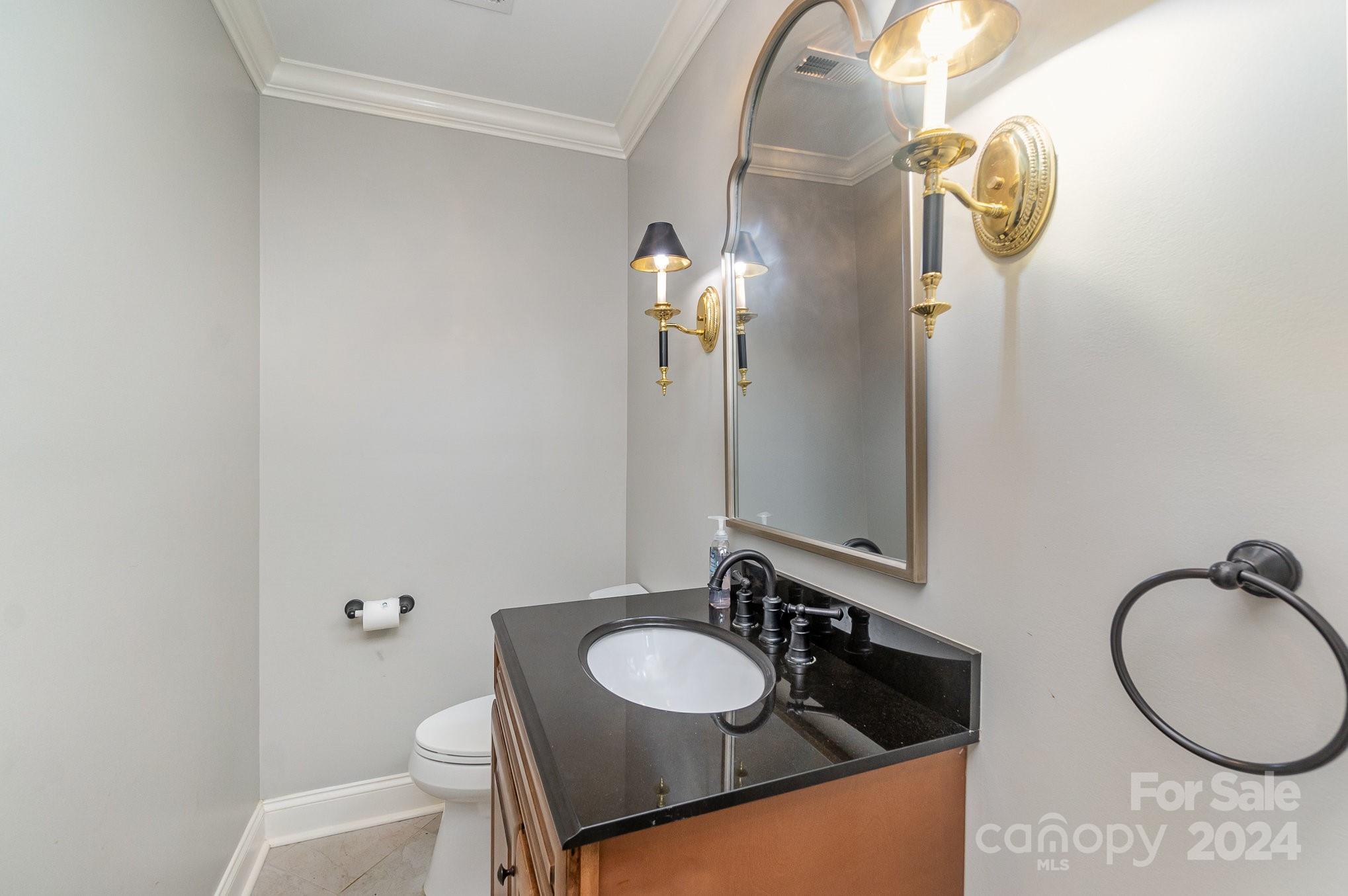 1008 Dumbarton Road Gastonia, NC 28054 - Photo 16 of 39 a bathroom with a granite countertop sink and a mirror