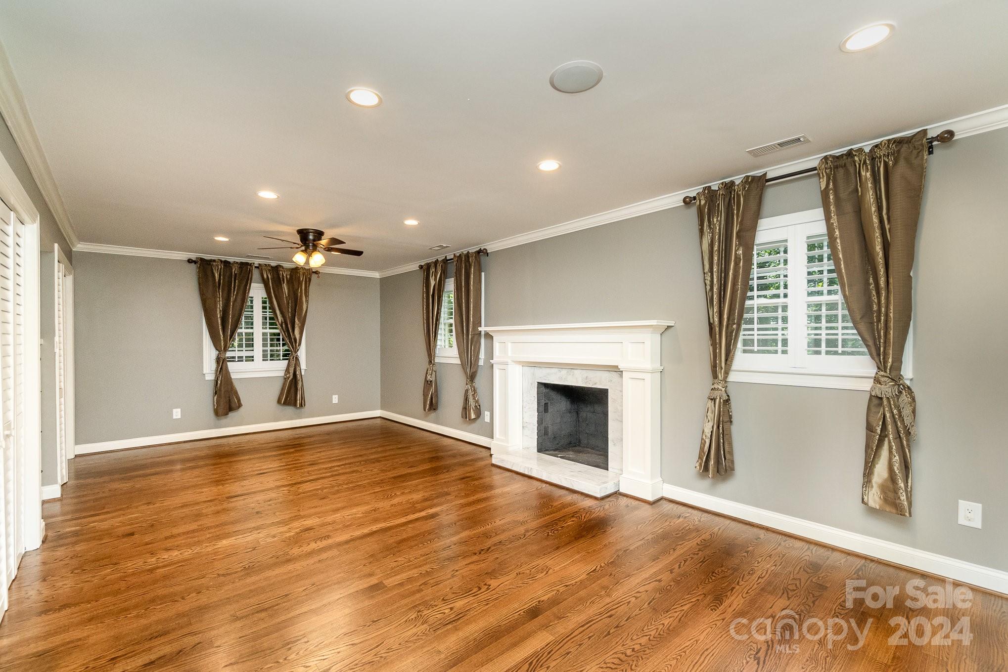 1008 Dumbarton Road Gastonia, NC 28054 - Photo 17 of 39 a view of an empty room with wooden floor and a window