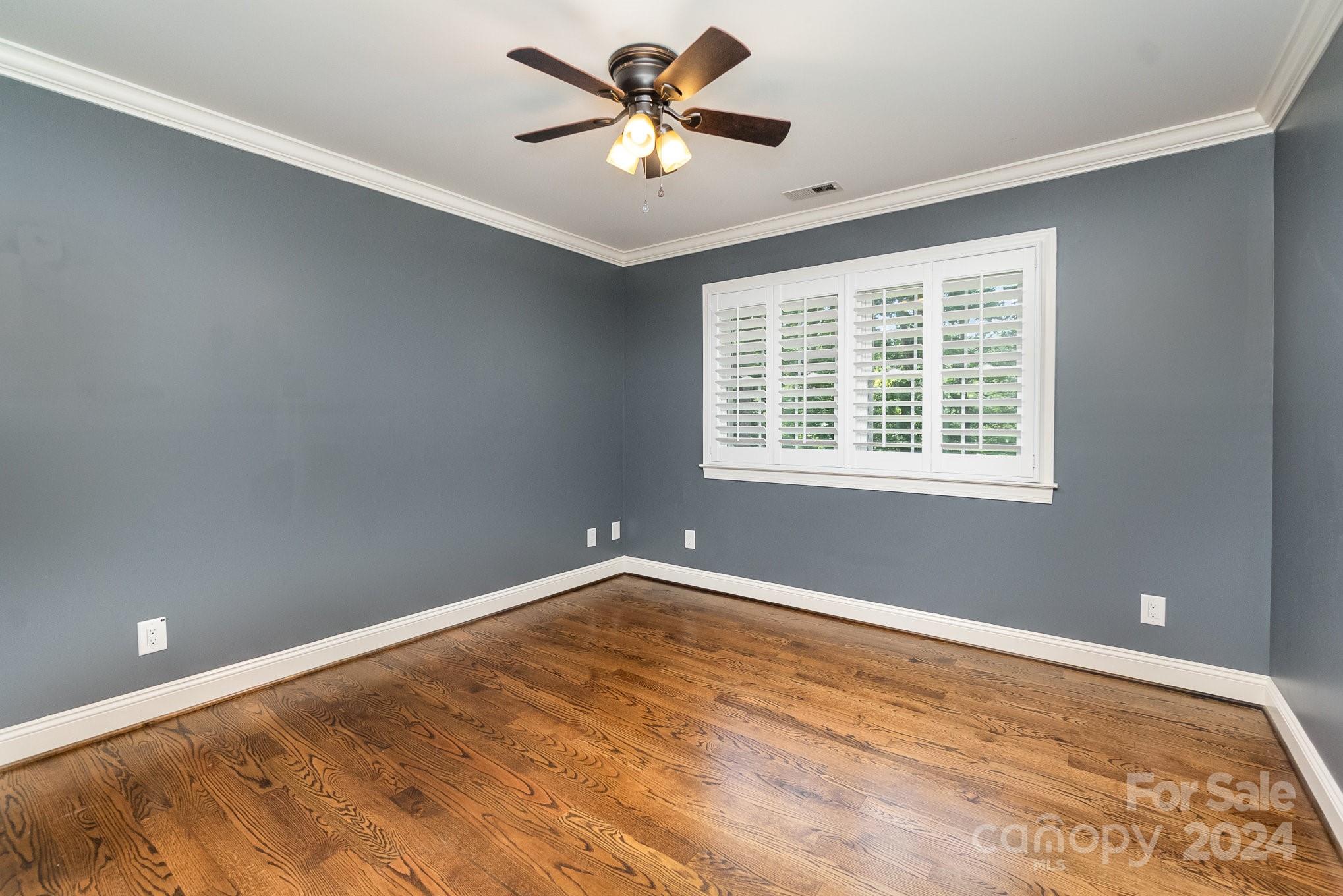 1008 Dumbarton Road Gastonia, NC 28054 - Photo 25 of 39 a view of a room with a ceiling fan and a window