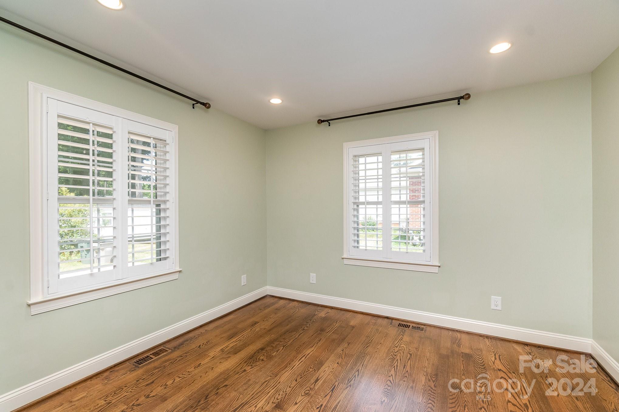 1008 Dumbarton Road Gastonia, NC 28054 - Photo 27 of 39 an empty room with wooden floor and windows