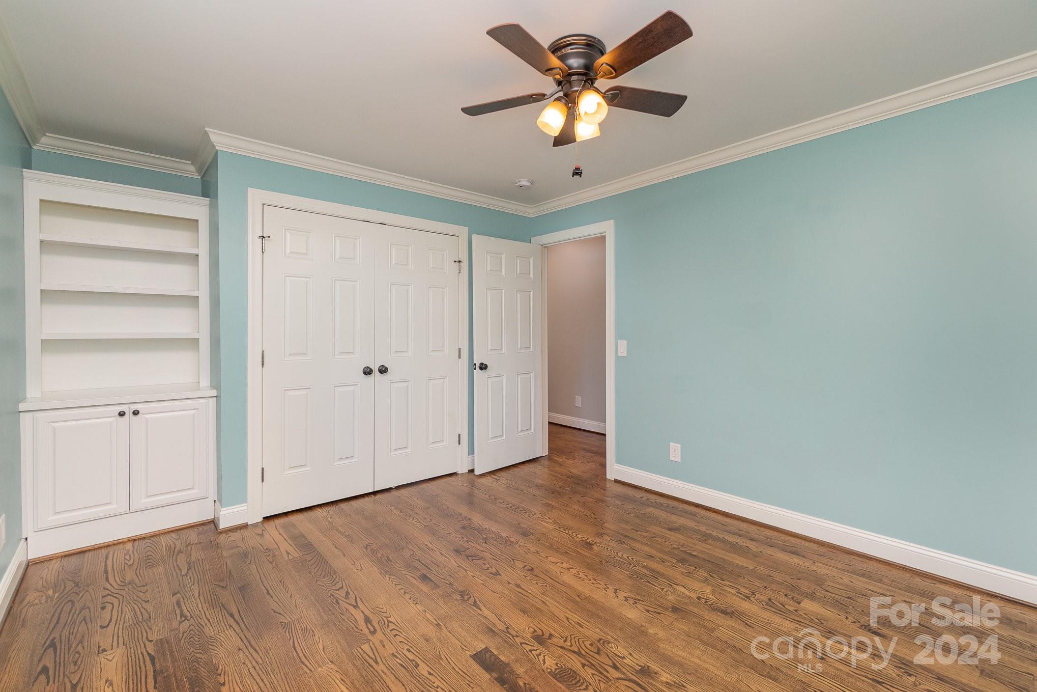 1008 Dumbarton Road Gastonia, NC 28054 - Photo 29 of 39 an empty room with closet and a ceiling fan