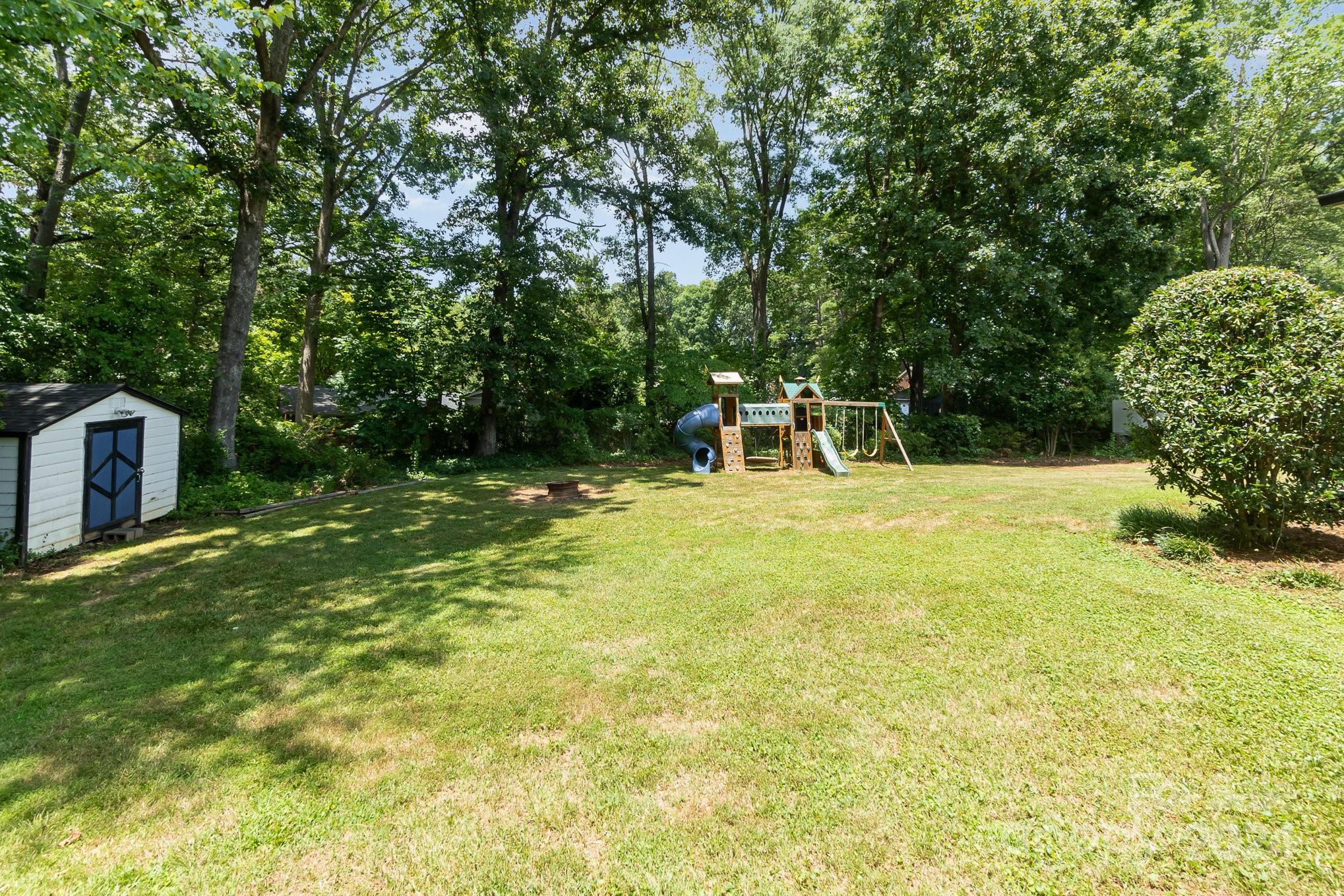 1008 Dumbarton Road Gastonia, NC 28054 - Photo 34 of 39 a view of lawn chairs and iron fence