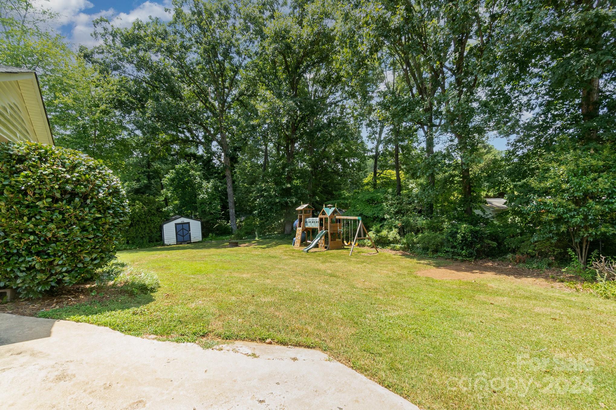 1008 Dumbarton Road Gastonia, NC 28054 - Photo 37 of 39 a swimming pool with some trees in the background