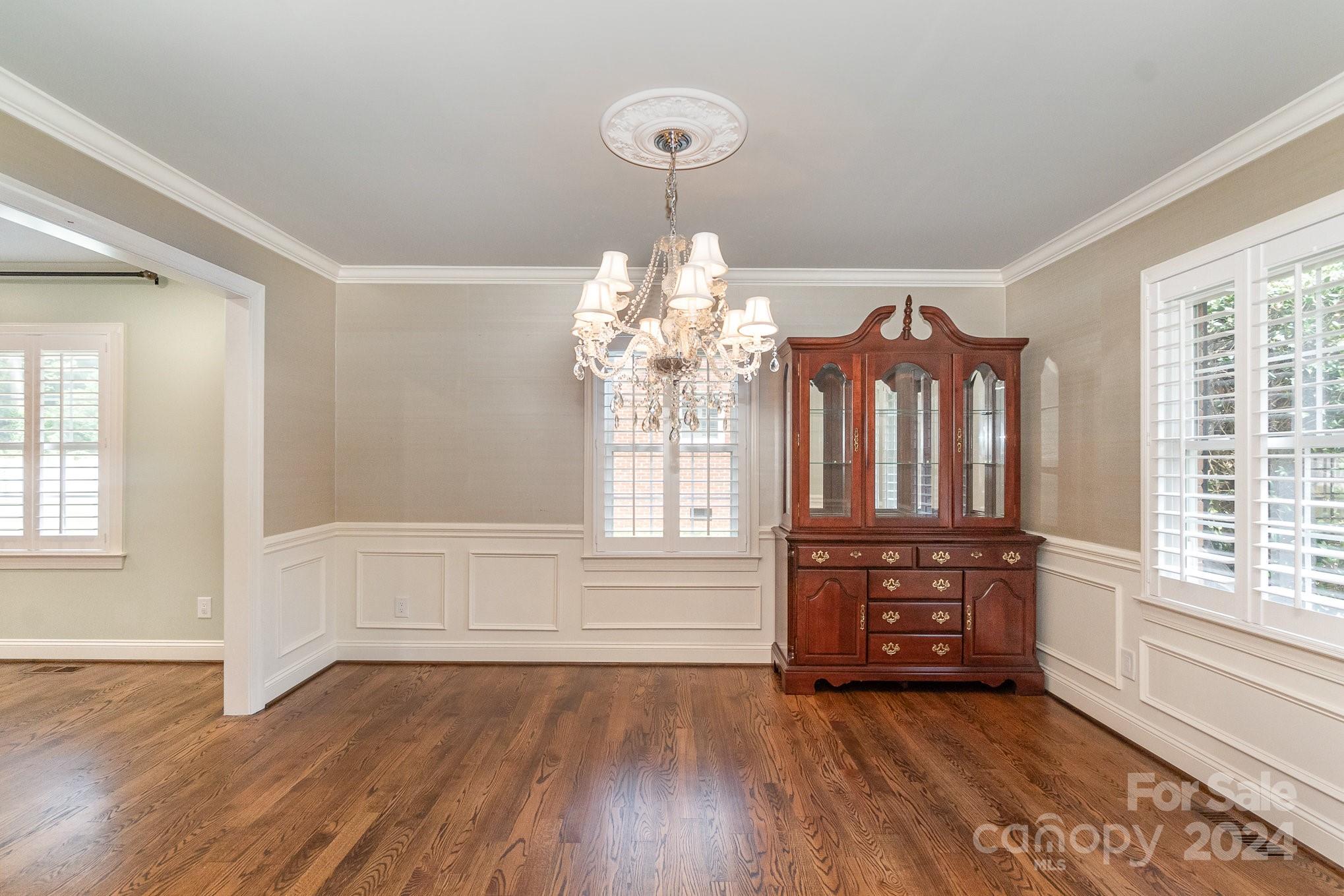 1008 Dumbarton Road Gastonia, NC 28054 - Photo 6 of 39 wooden floor in an empty room with a window