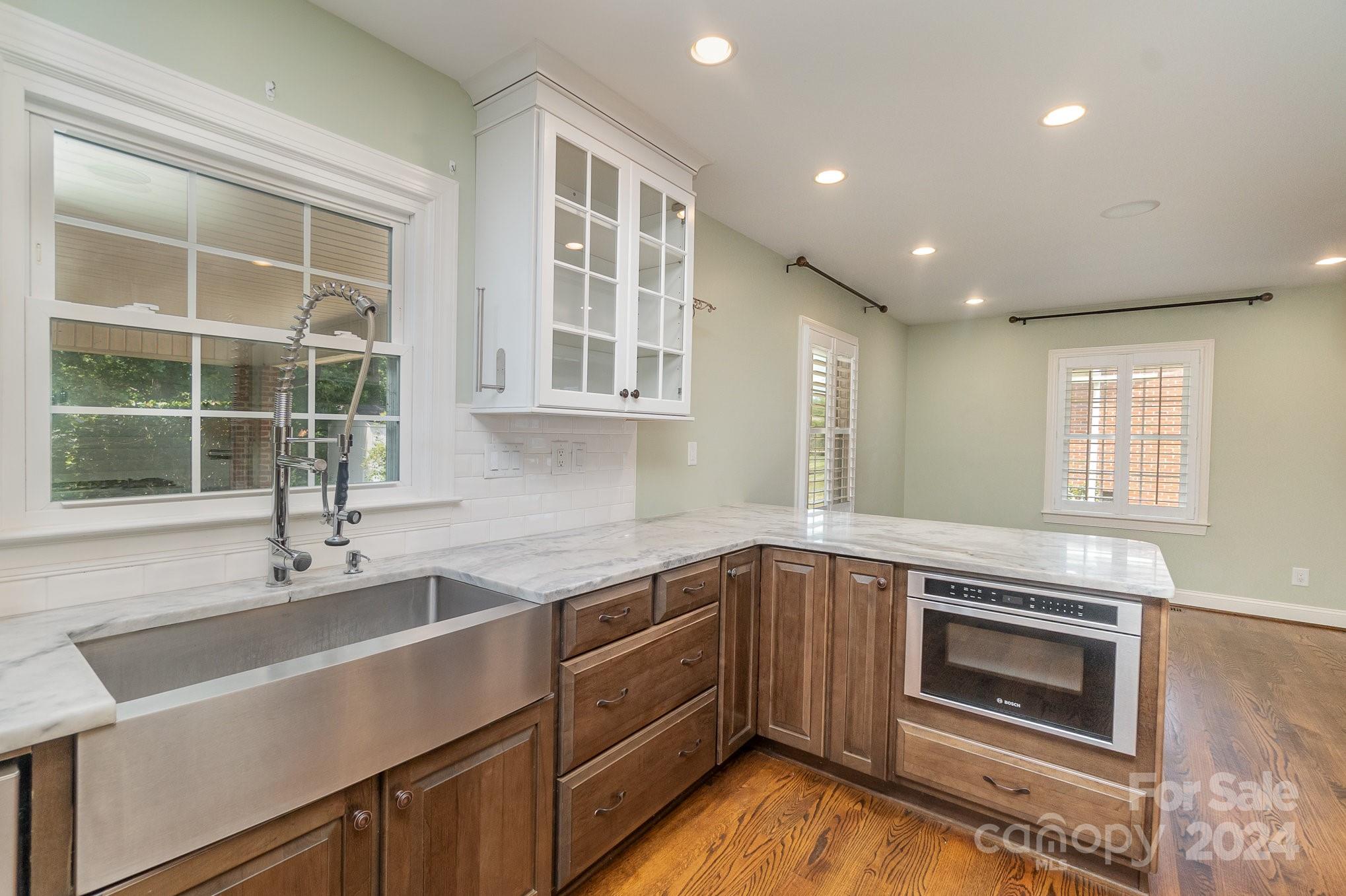 1008 Dumbarton Road Gastonia, NC 28054 - Photo 8 of 39 a kitchen with a sink and windows