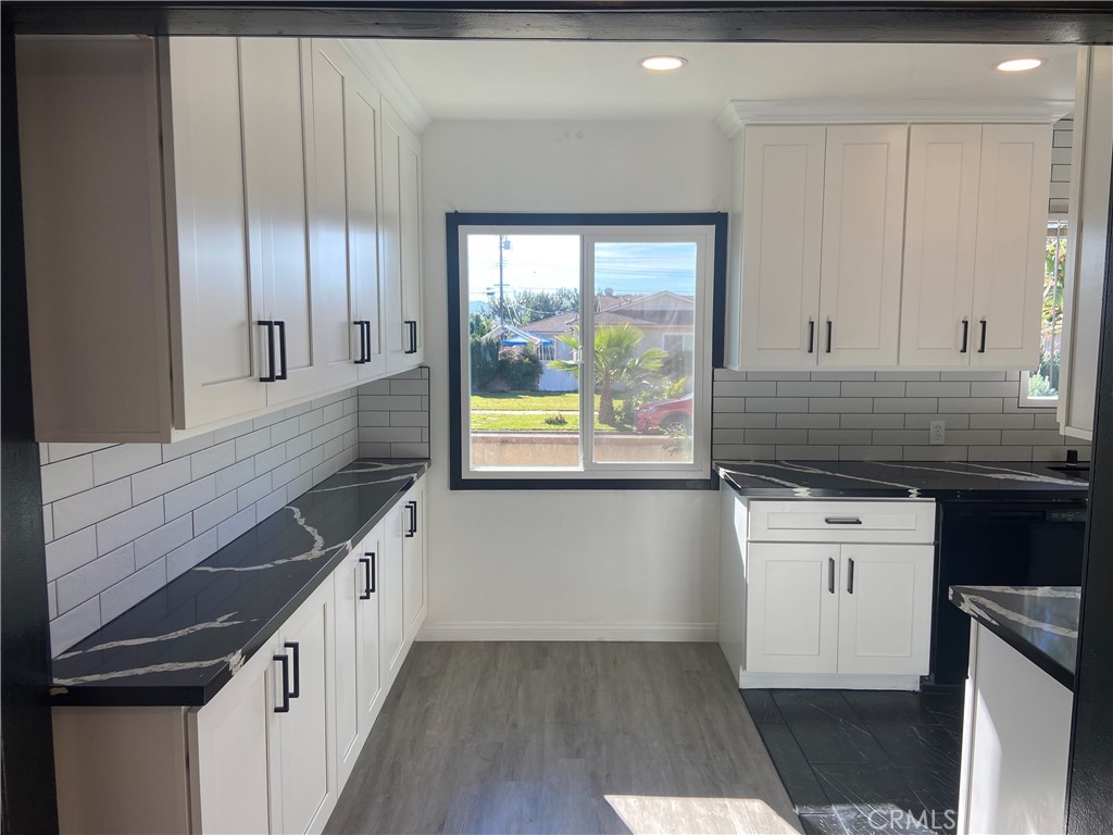 856 Altura Way Upland, CA 91786 - Photo 12 of 33 a kitchen with stainless steel appliances granite countertop a stove a sink and a refrigerator