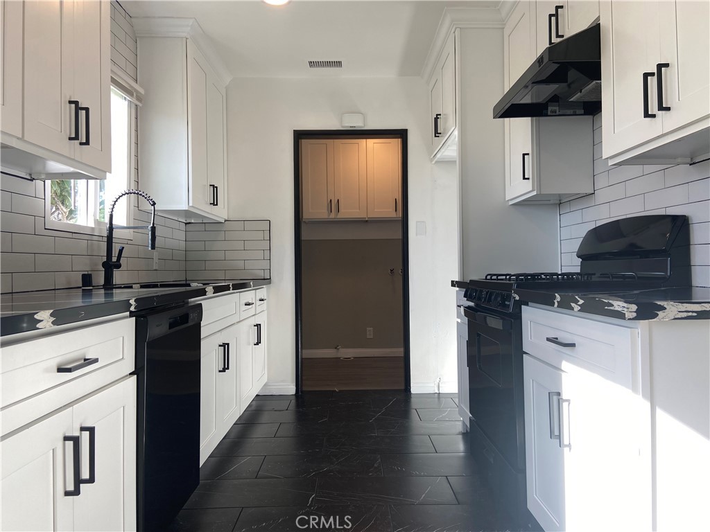 856 Altura Way Upland, CA 91786 - Photo 15 of 33 a kitchen with stainless steel appliances granite countertop a sink stove and refrigerator