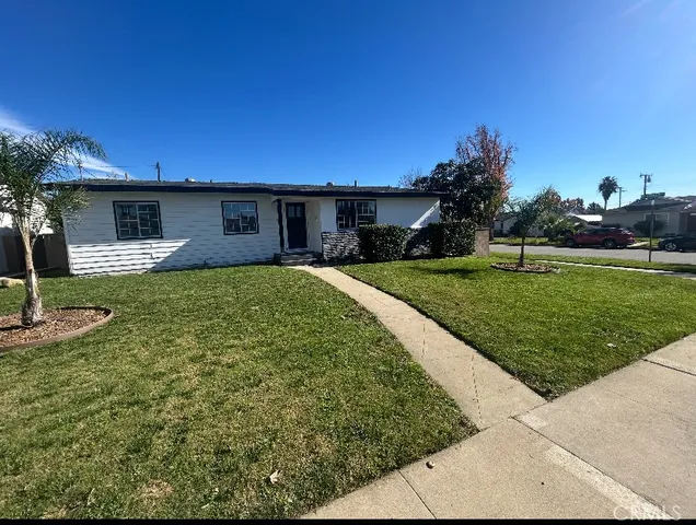a view of a backyard with a garden and plants