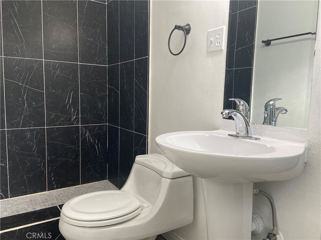 856 Altura Way Upland, CA 91786 - Photo 26 of 33 a bathroom with a sink toilet and shower