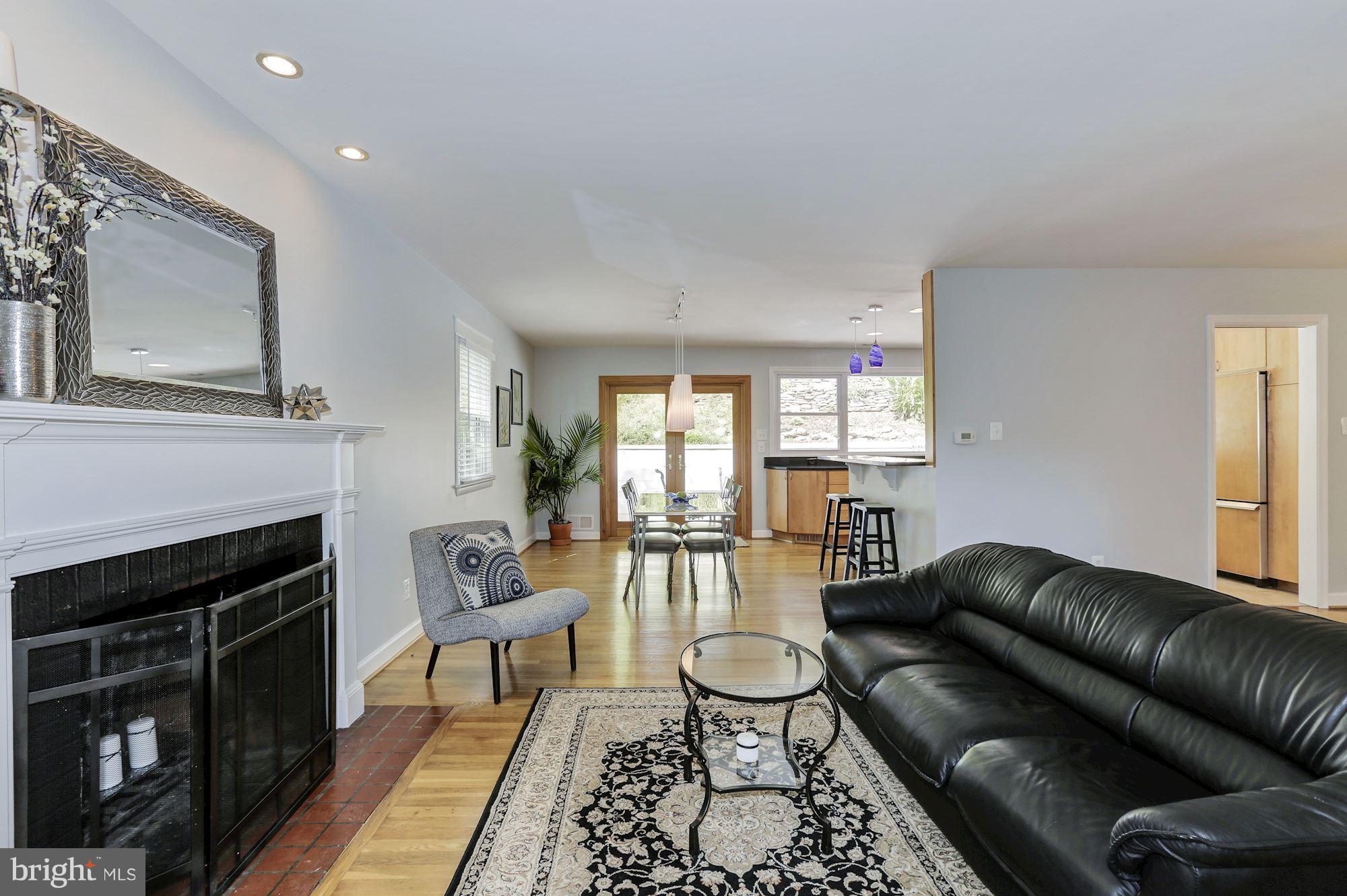 1806 Courtland Road Alexandria, VA 22306 - Photo 3 of 30 Living Room w/ Fireplace Opens to Dining Room