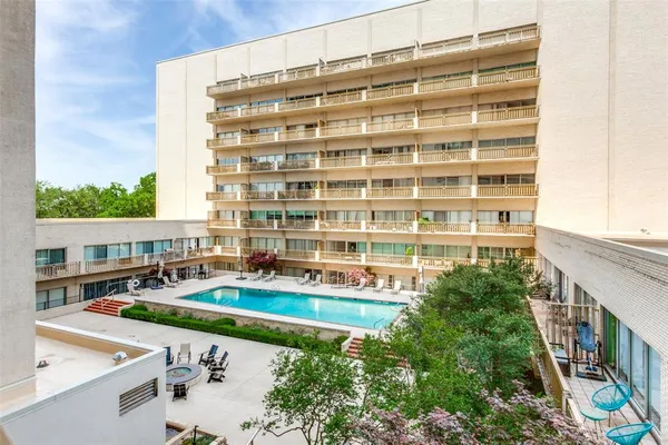 a picture of a table and chairs and potted plants on the wooden floor