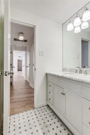 a bathroom with a sink a mirror and a shower