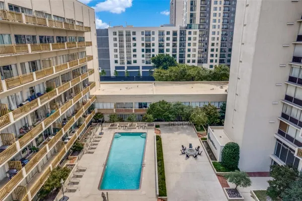 a view of balcony with outdoor seating and city view