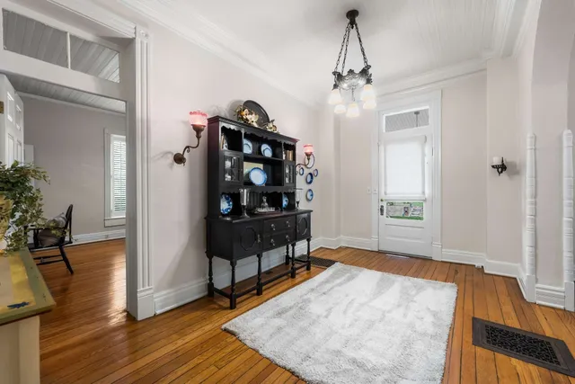 a large kitchen with stainless steel appliances granite countertop a lot of counter space and a sink