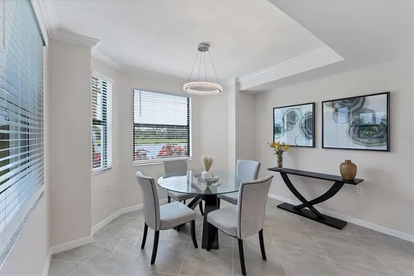 a view of a dining room with furniture window and outside view