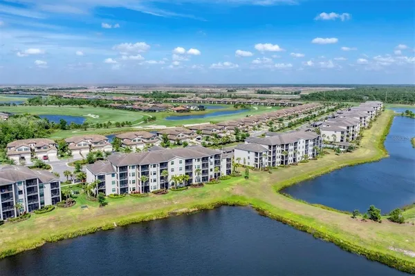 a view of a city with a lake