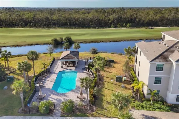 a view of a porch with furniture and garden
