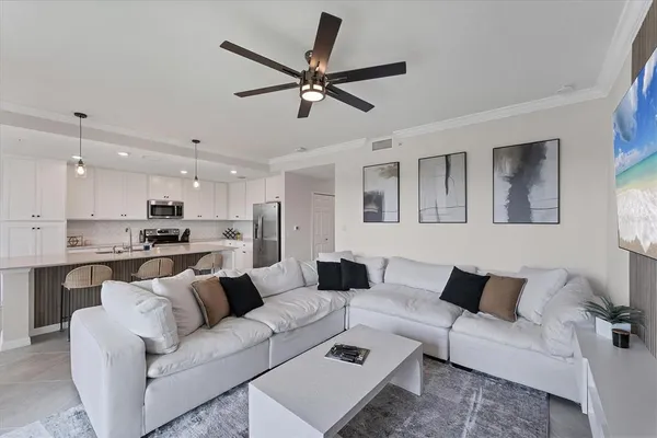 a living room with furniture white walls and white walls