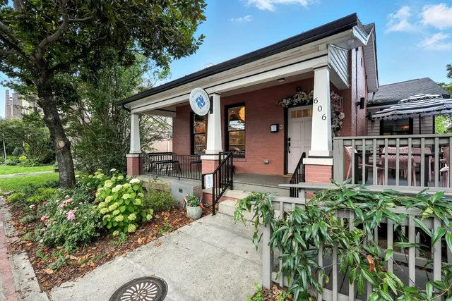 a view of a house with a flower garden