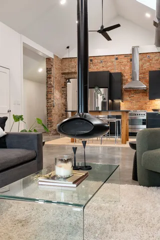 a living room with furniture and a fireplace