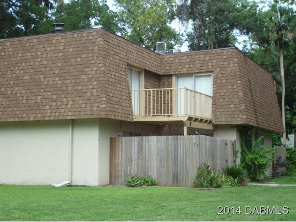 75 Springwood Square Port Orange, FL 32129 - Photo 6 of 6 a view of a house with a yard