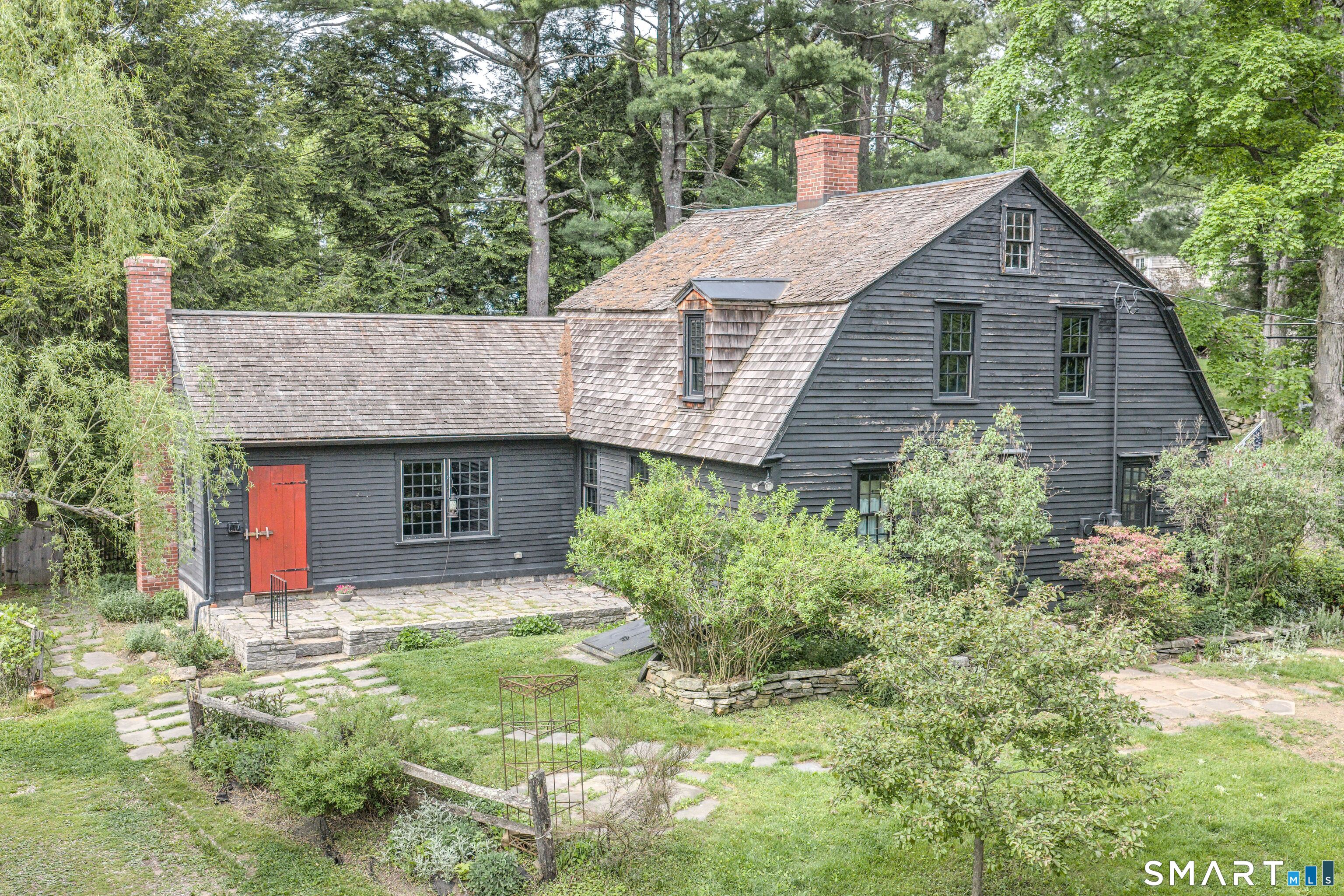 261 Hebron Road Bolton, CT 06043 - Photo 2 of 40 a aerial view of a house with yard and trees