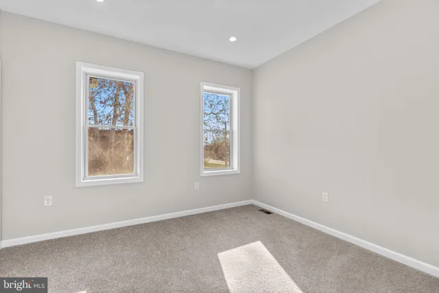 an empty room with windows