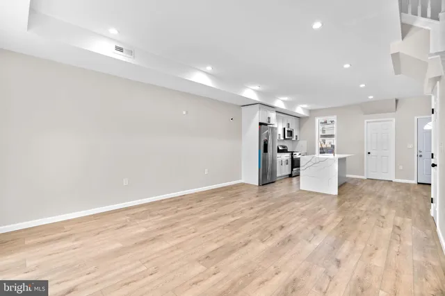 a view of a livingroom with a kitchen