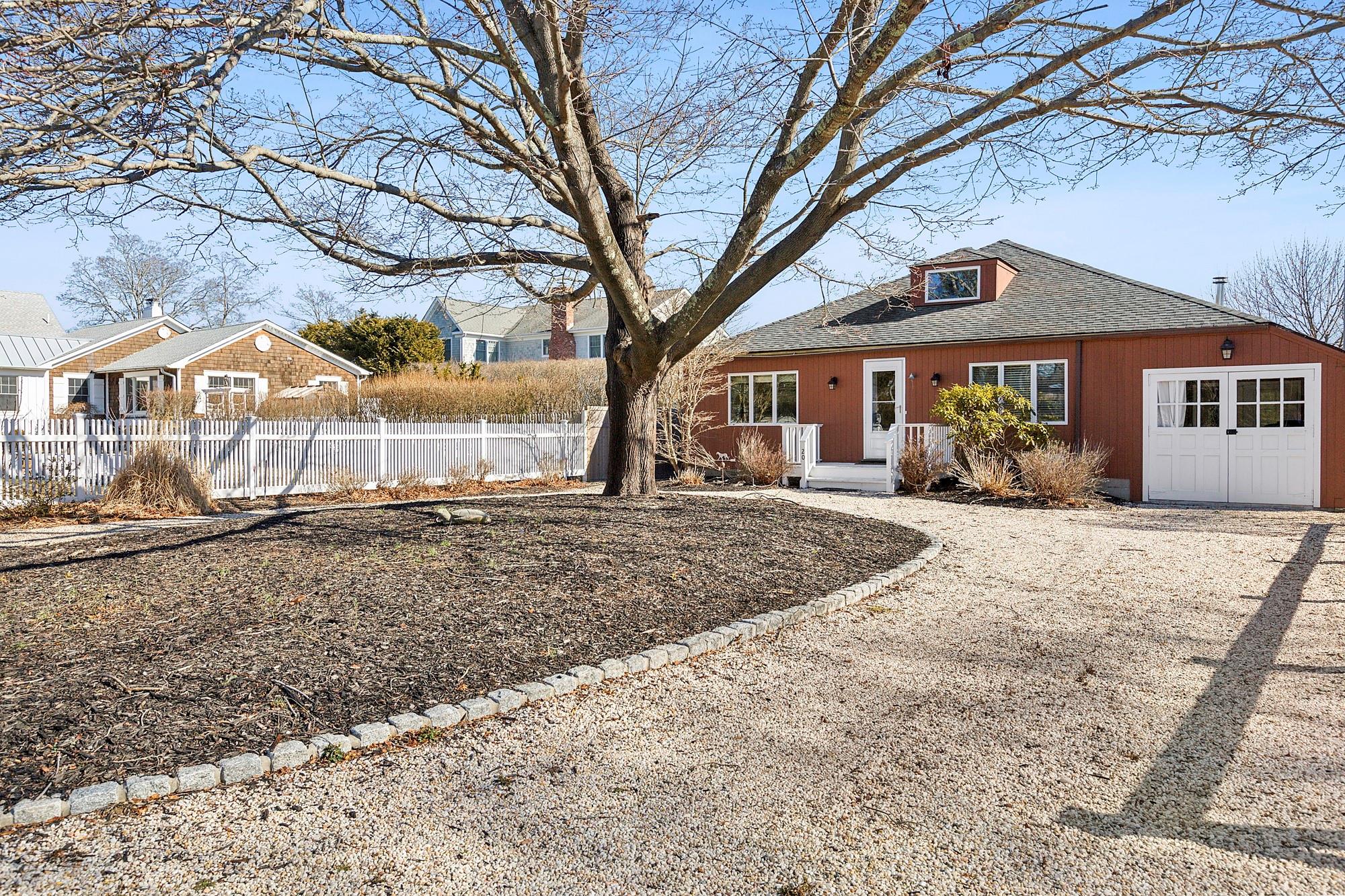 20 Mitchell Road Westhampton Beach, NY 11978 - Photo 1 of 16 a front view of a house with garden