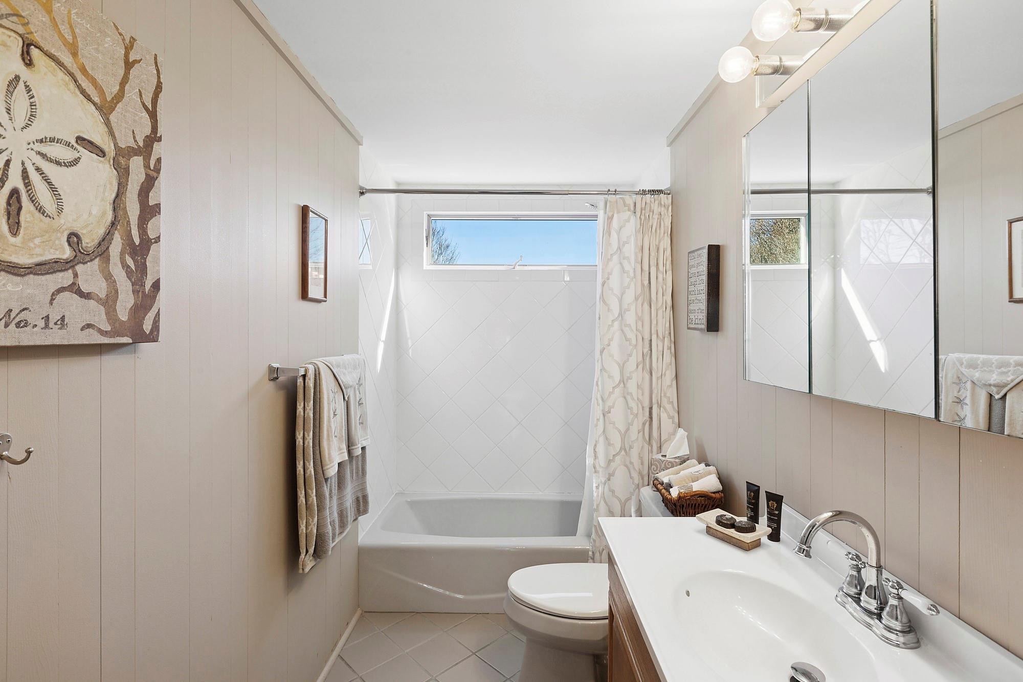 20 Mitchell Road Westhampton Beach, NY 11978 - Photo 12 of 16 a bathroom with a sink toilet and shower