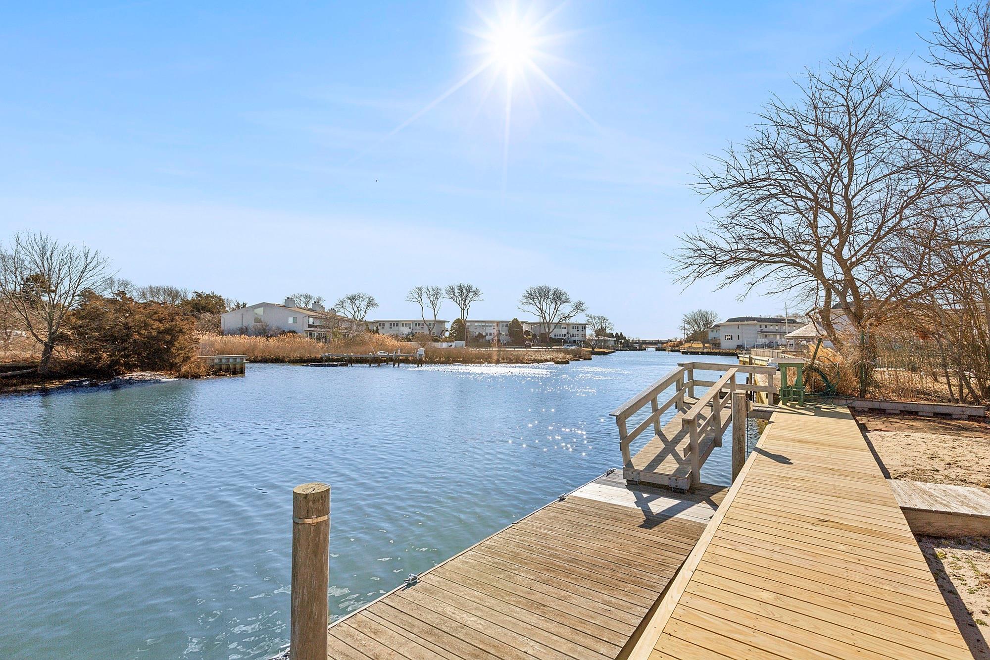 20 Mitchell Road Westhampton Beach, NY 11978 - Photo 3 of 16 a view of a wooden floor and lake
