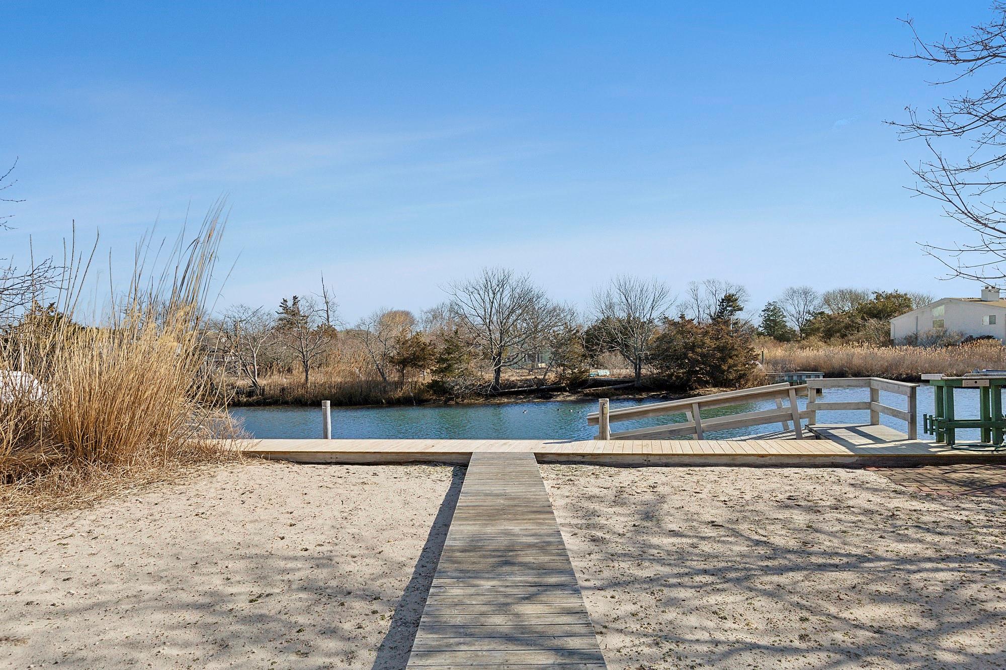 20 Mitchell Road Westhampton Beach, NY 11978 - Photo 4 of 16 a view of swimming pool with a yard