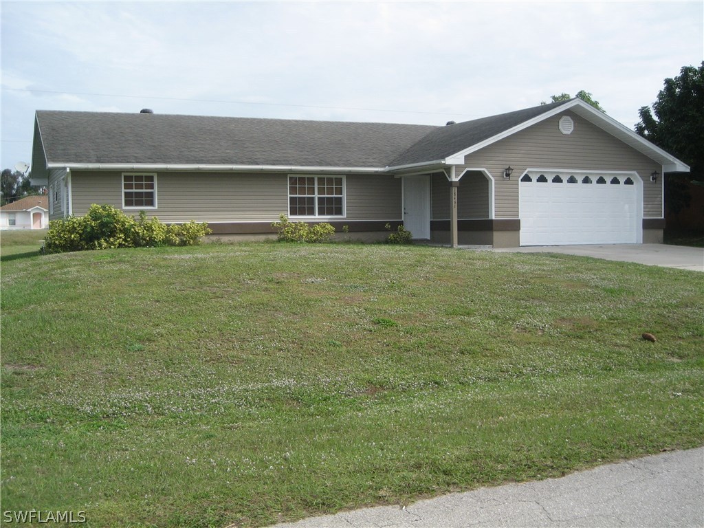 18461 Geranium Road Fort Myers, FL 33967 - Photo 1 of 17 a front view of a house with a garden