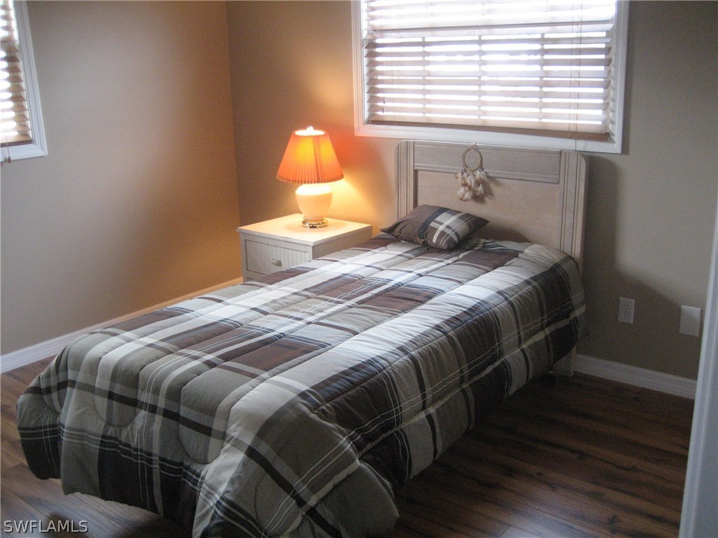 18461 Geranium Road Fort Myers, FL 33967 - Photo 11 of 17 a bedroom with a bed and window