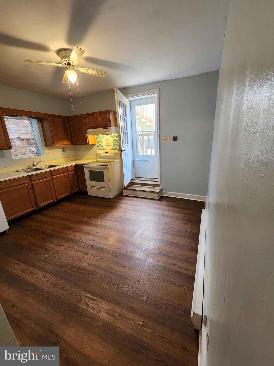 10 North Main Street, Unit 4 Union Bridge, MD 21791 - Photo 2 of 9 a view of an empty room with window and wooden floor