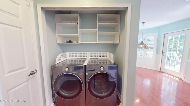 a utility room with dryer and washer