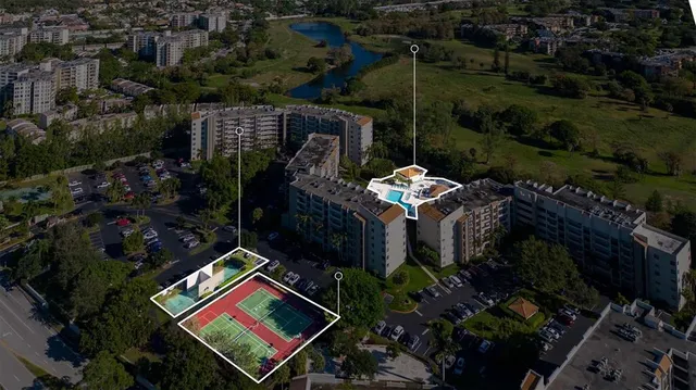 an aerial view of a houses with street