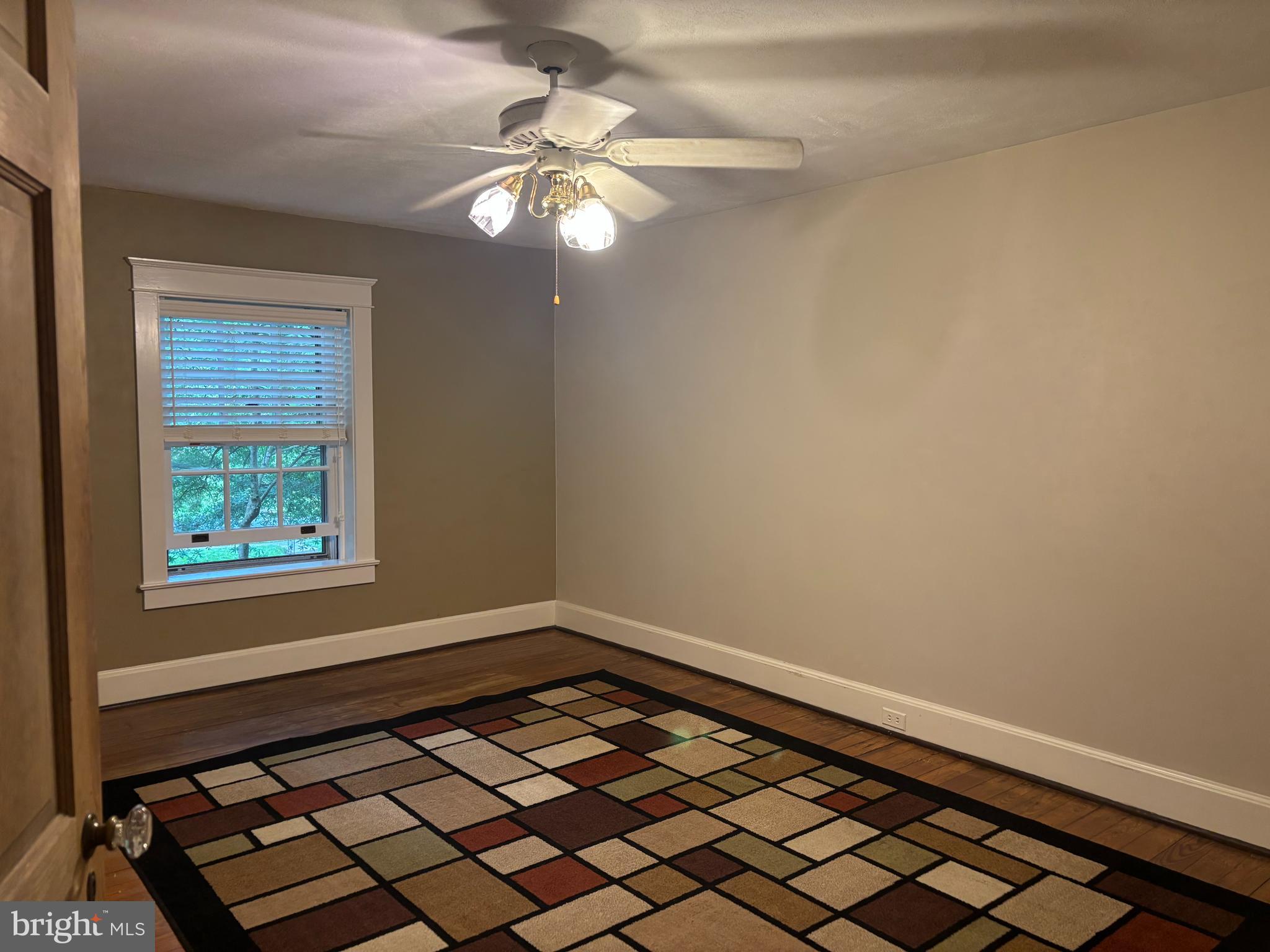 1121 Spring Grove Avenue Lancaster, PA 17603 - Photo 12 of 25 a view of a room with wooden floor and fan