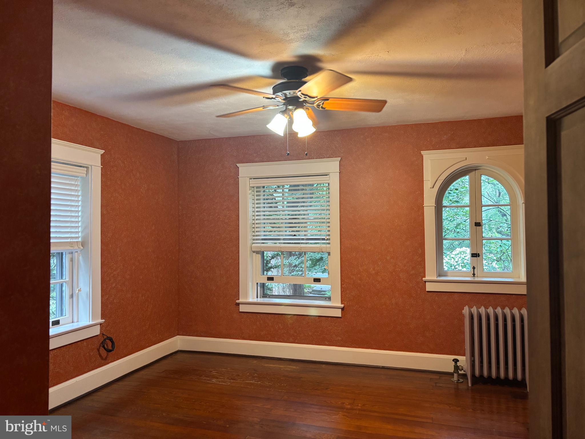 1121 Spring Grove Avenue Lancaster, PA 17603 - Photo 13 of 25 a view of an empty room with window and wooden floor