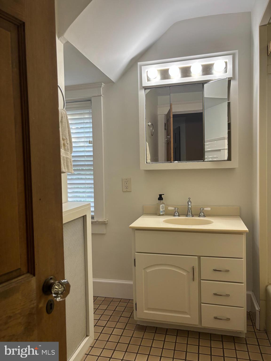 1121 Spring Grove Avenue Lancaster, PA 17603 - Photo 15 of 25 a bathroom with a sink a toilet and mirror