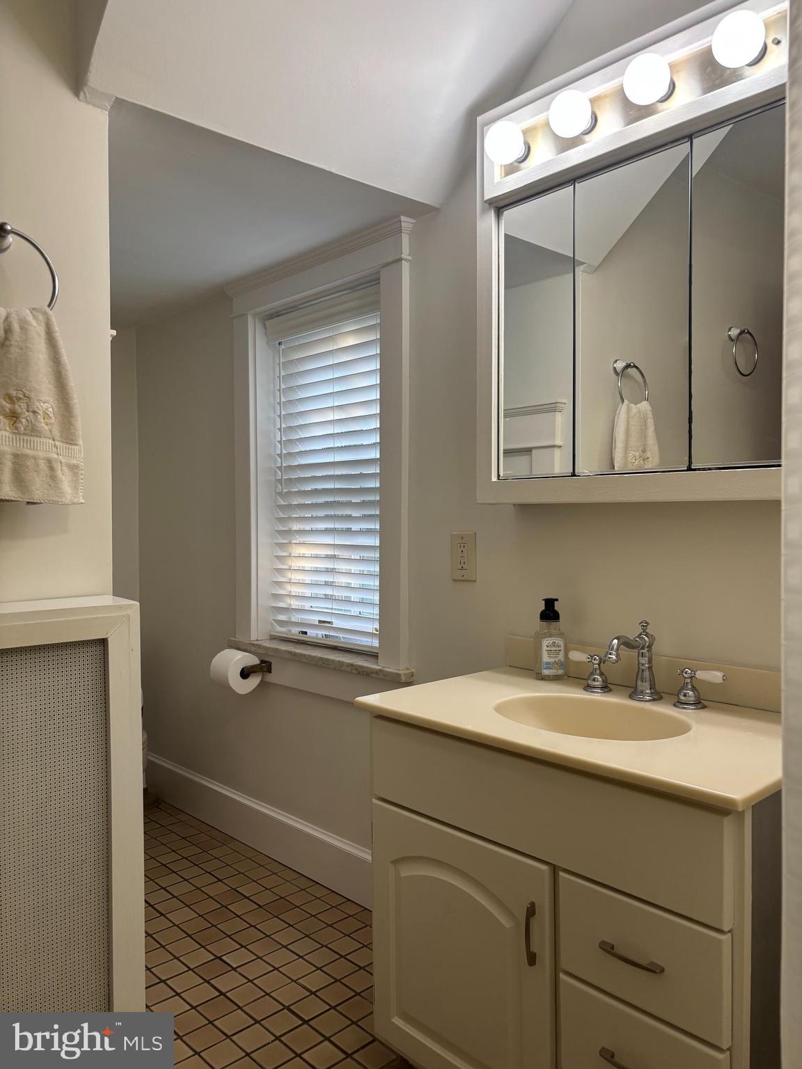1121 Spring Grove Avenue Lancaster, PA 17603 - Photo 16 of 25 a bathroom with a sink and two mirror